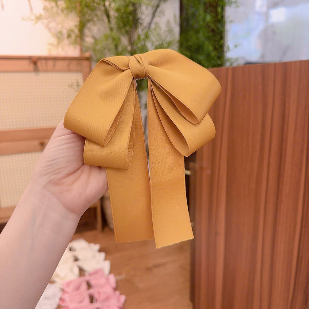 Kẹp bấm tóc NƠ VÀNG tầng B2918