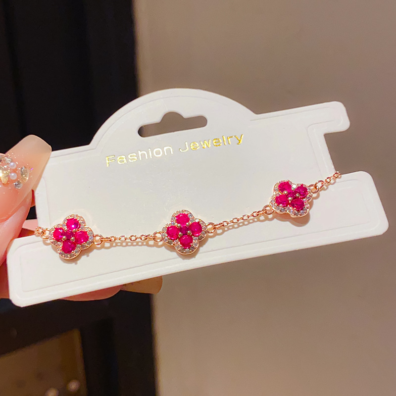 Lắc tay cỏ 4 lá đá Hồng màu vàng hồng độc đáo B2954