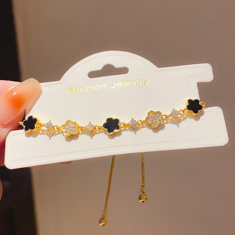 Lắc tay HOA ĐEN mix Hoa ĐÁ zircon cao cấp xi vàng pha dạng rút freesize B2958